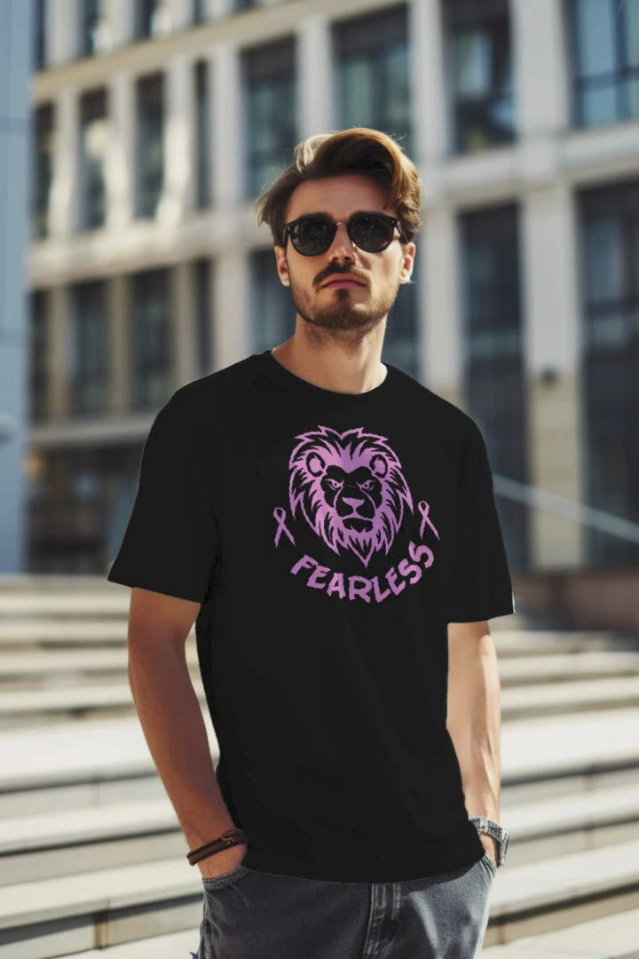 Man wearing a black Three G's Custom Designs Fearless lion graphic t-shirt with a pink awareness ribbon design.